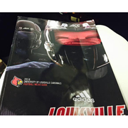 2014 Louisville Football Media Guide signed by Lorenzo Mauldin